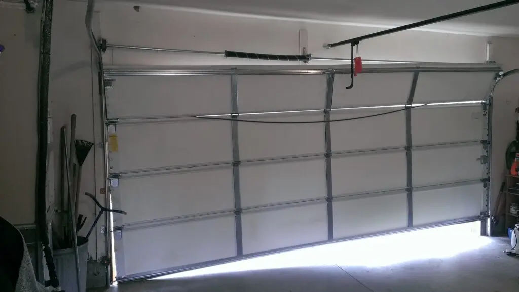 crooked garage door hit something while moving