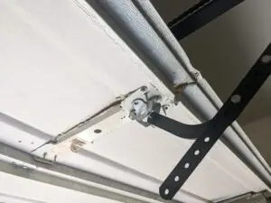 garage door top section damage due to broken spring