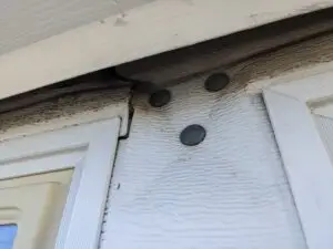garage door damaged because opener arm was bolted directly to the door
